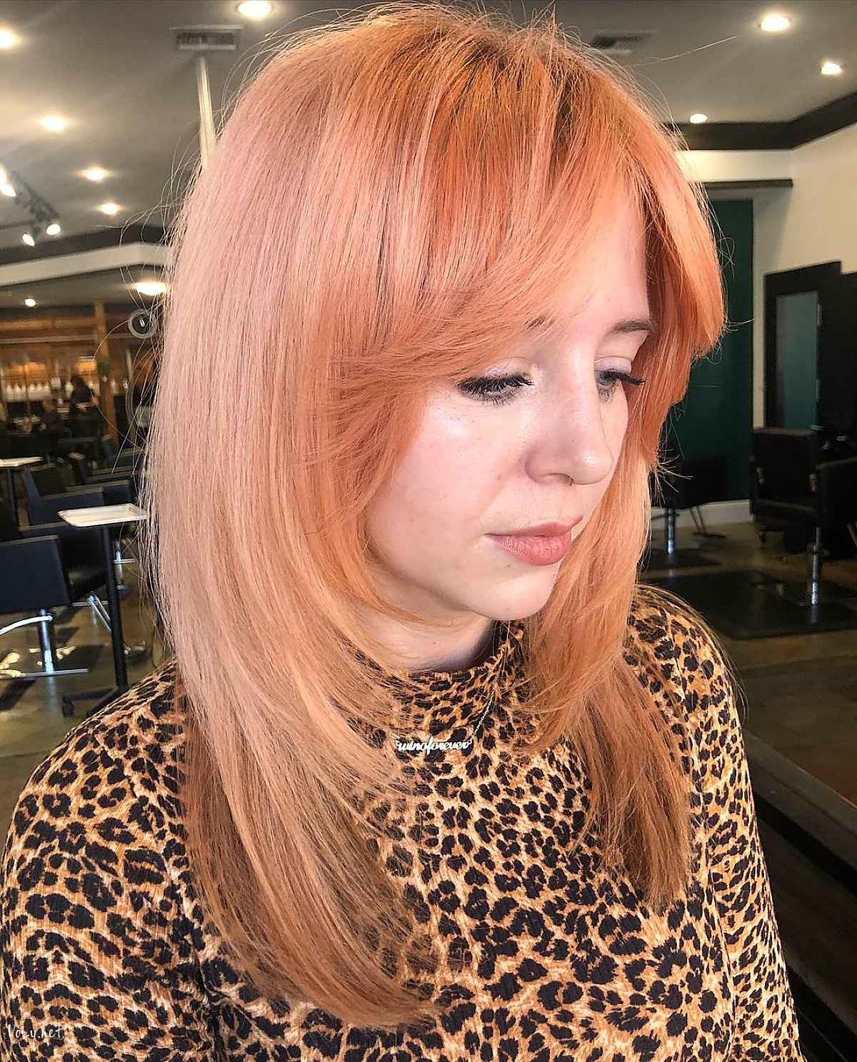 medium length layered cut with a face frame