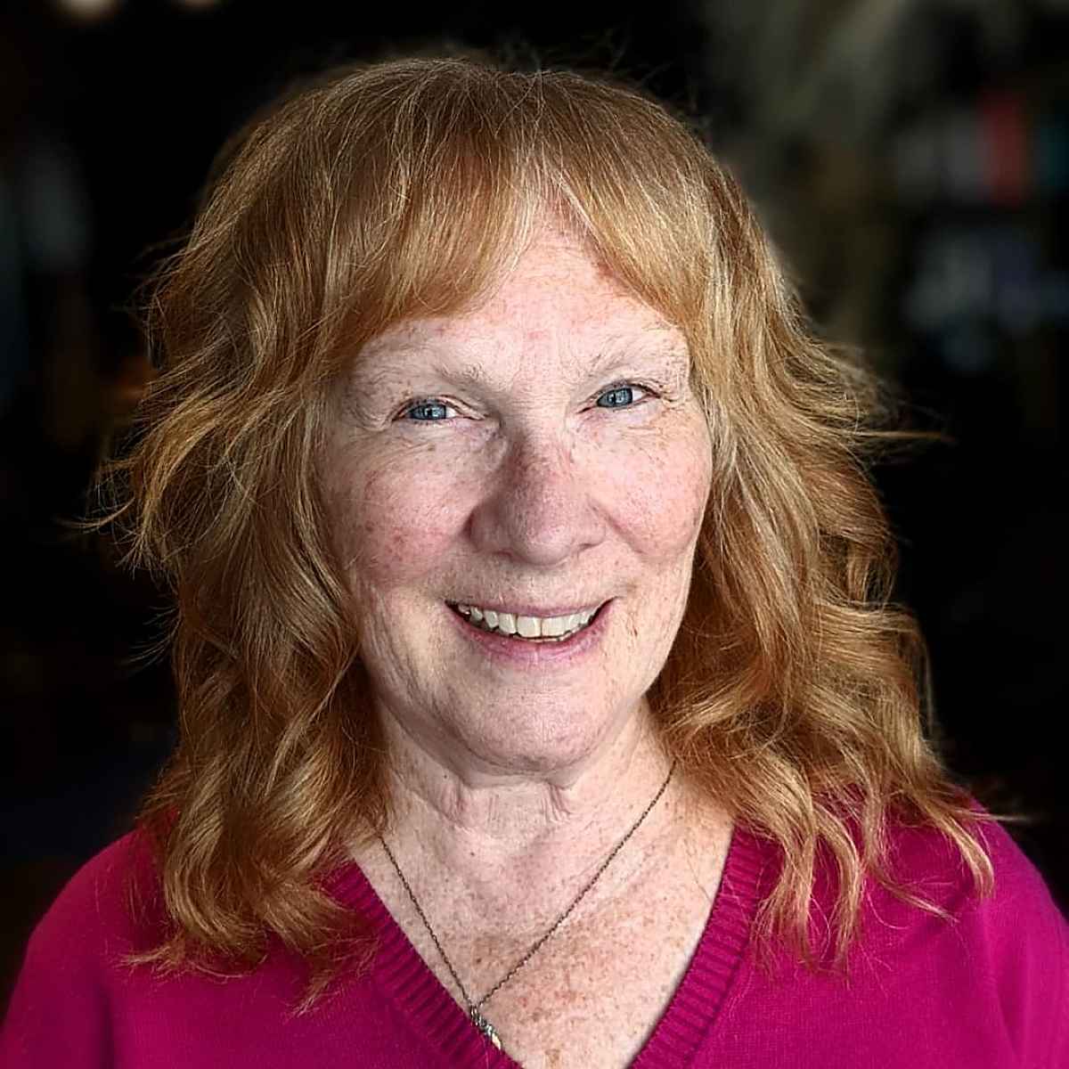 medium length shag cut with curtain bangs for women over 60