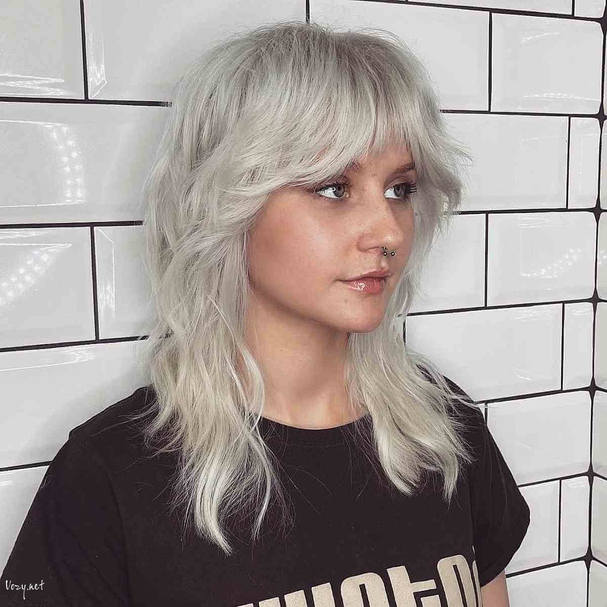 medium length wolf cut with curtain bangs