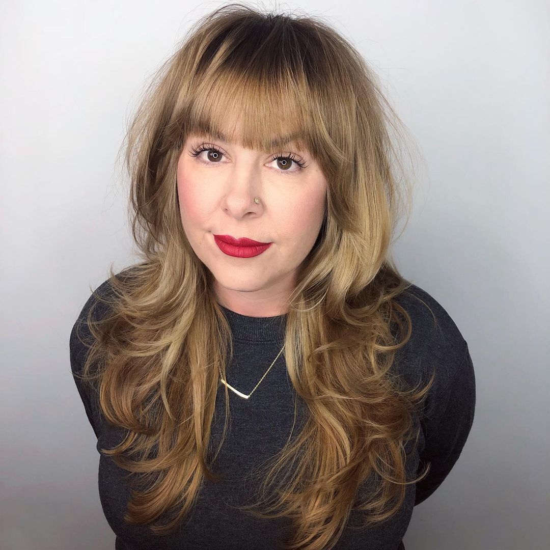 medium to long feathered shag with bangs