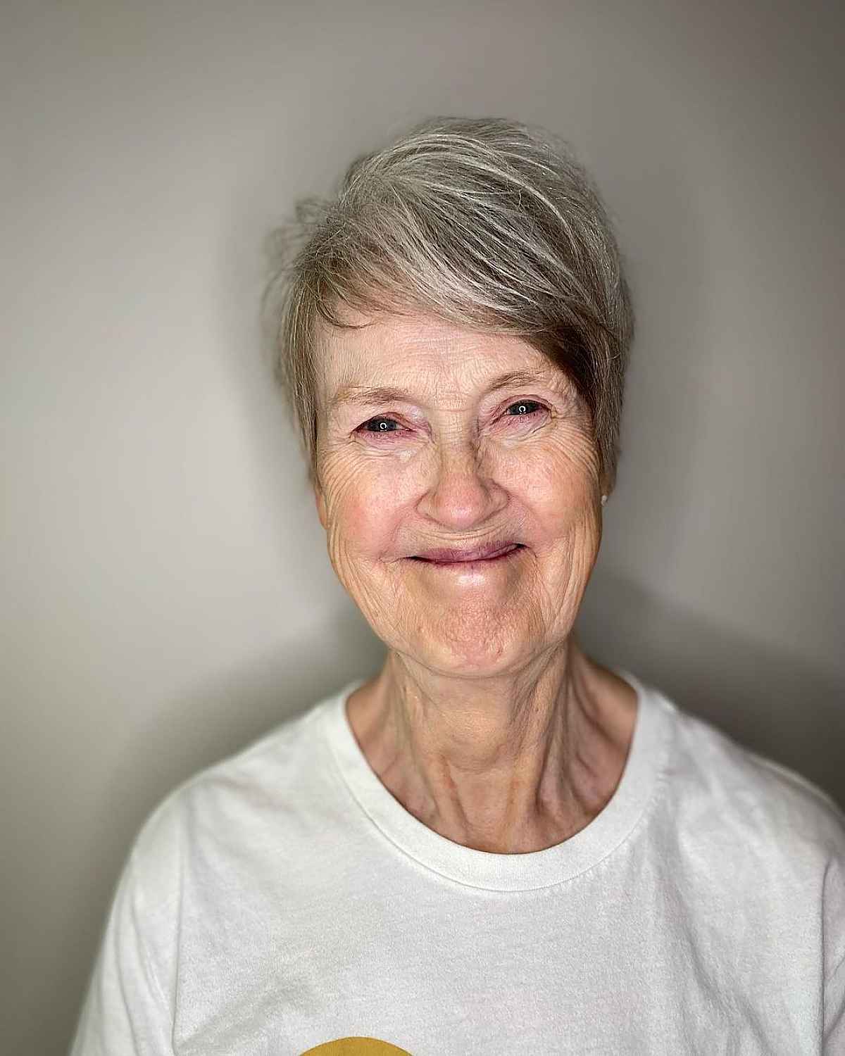 messy grey pixie hairstyle for women over sixty