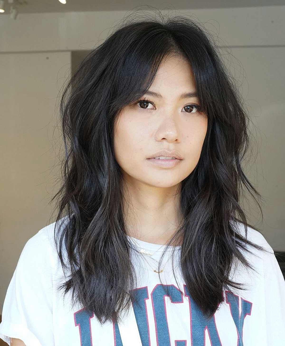 messy shag with center parted bangs