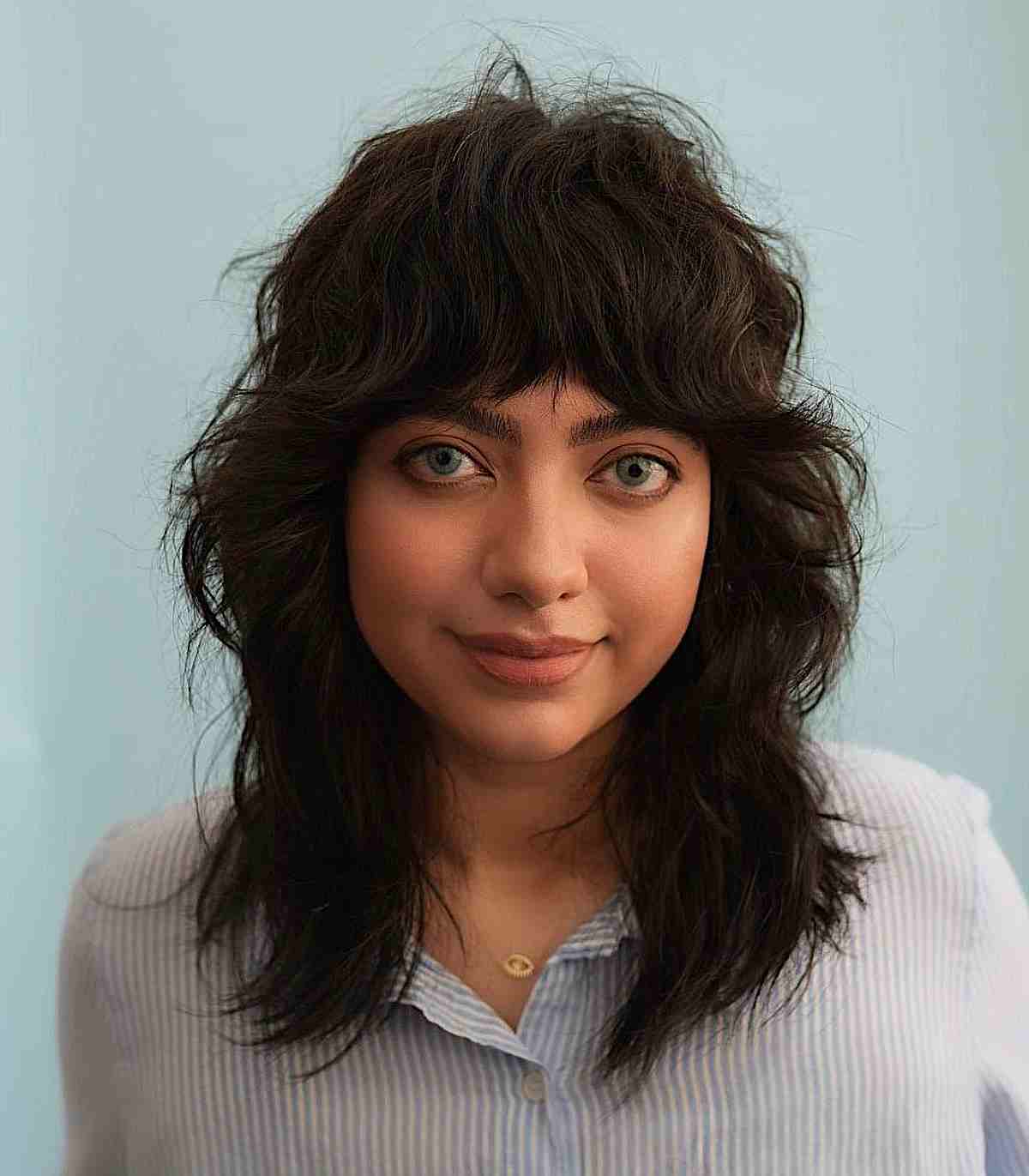 mid length cut with full curtain bangs