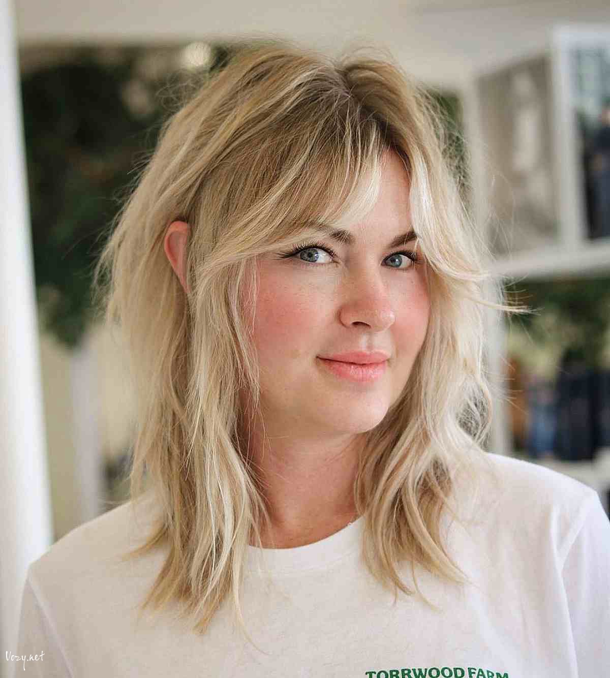 mid length disheveled blonde shag with curtain fringe