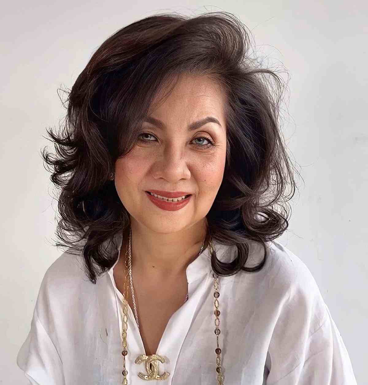 mid length feathered hair with soft waves