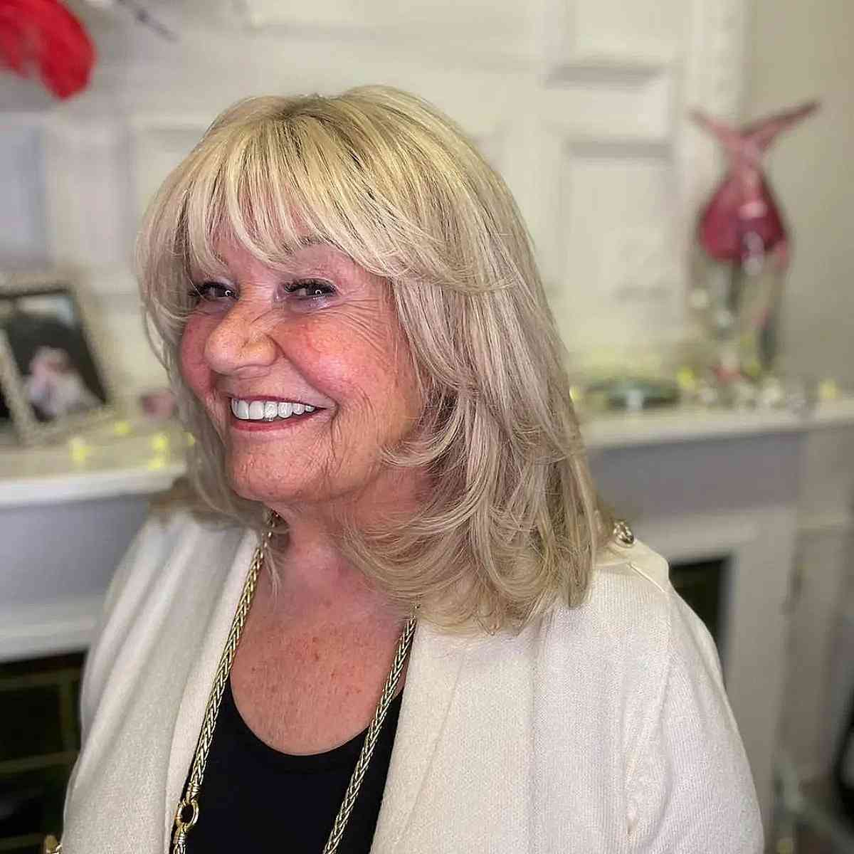 mid length swoopy layers with see through bangs