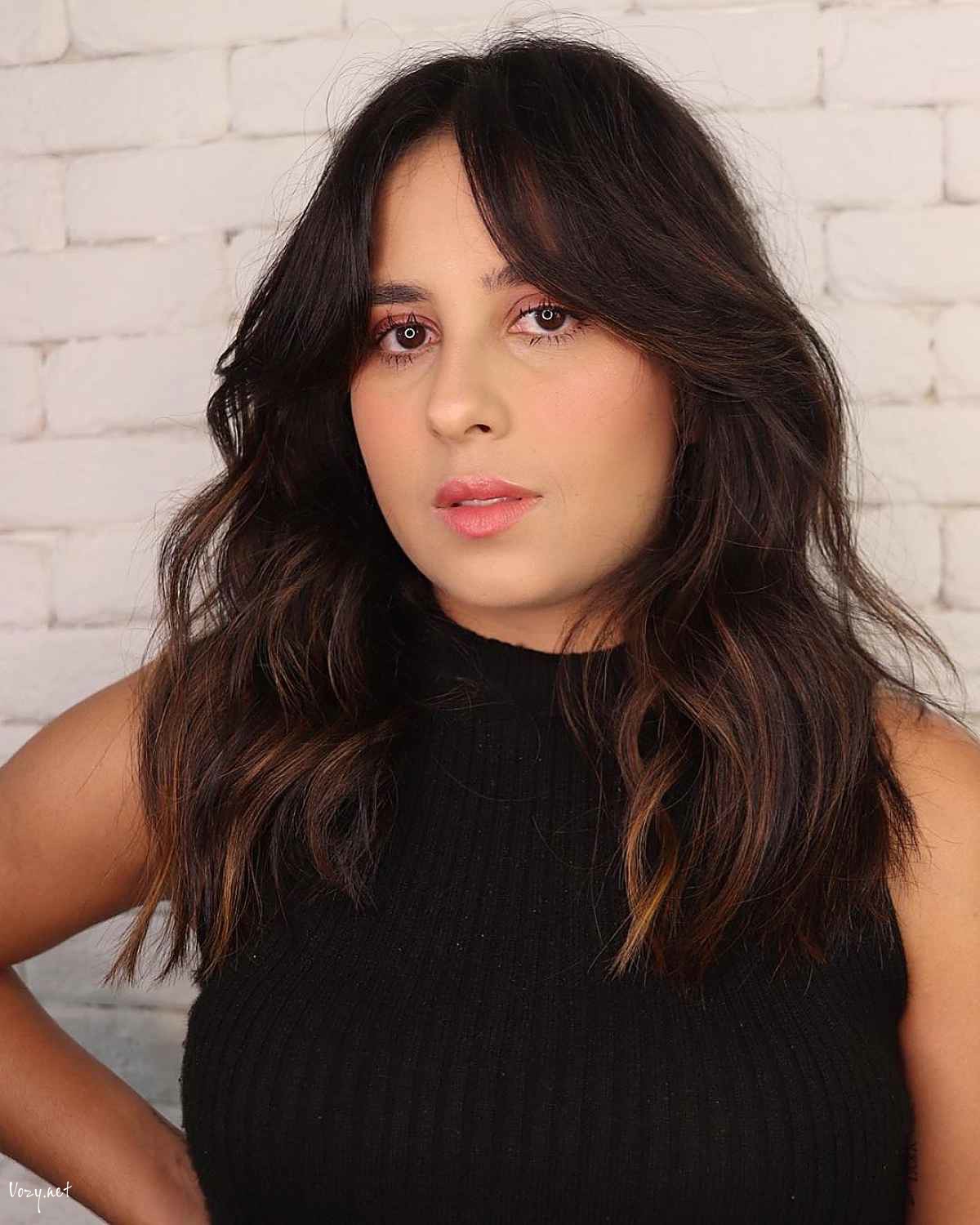 middle parted hairstyle with bardot bangs