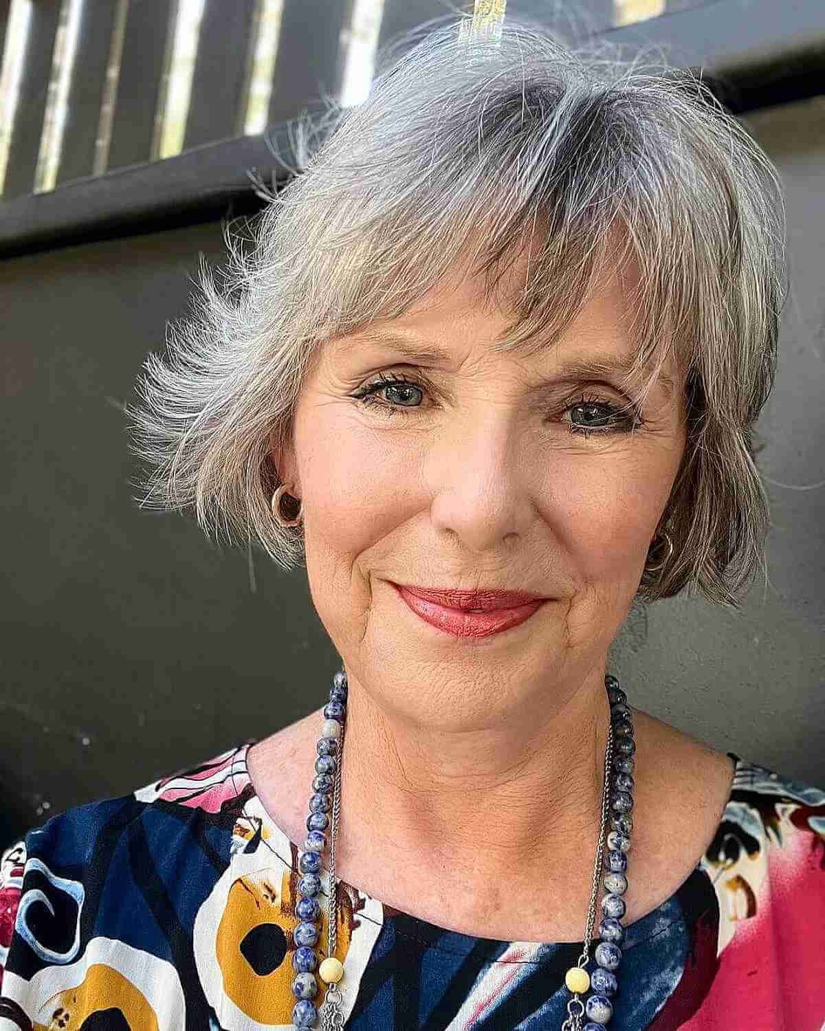 natural choppy salt and pepper bob haircut with bangs for 70 year olds