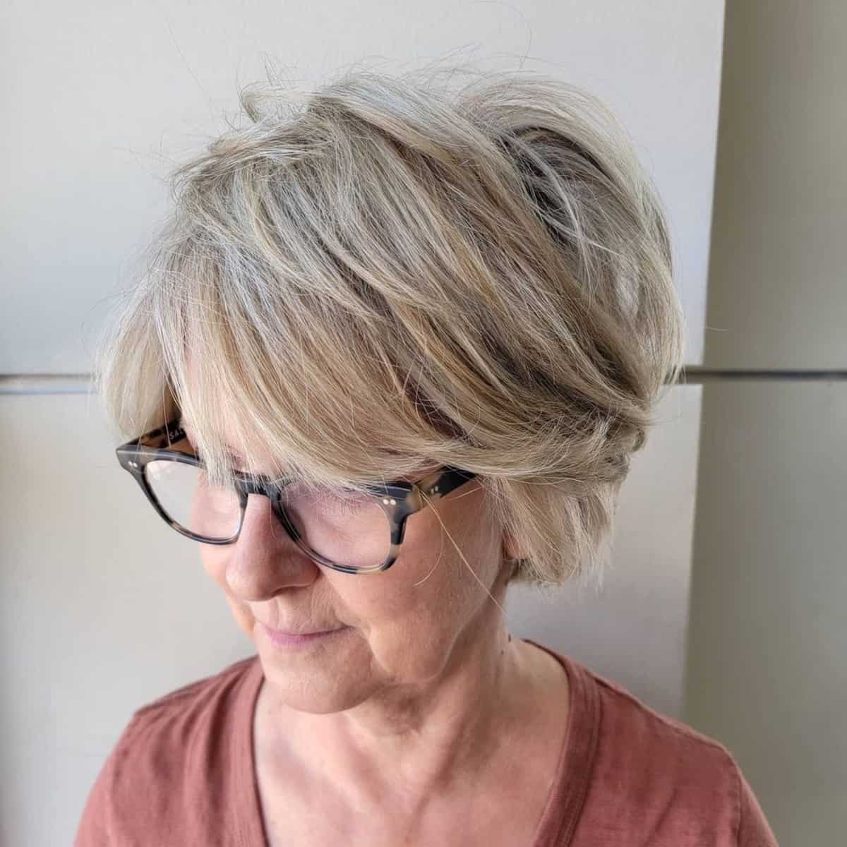over 60 tousled razor cut bob with glasses