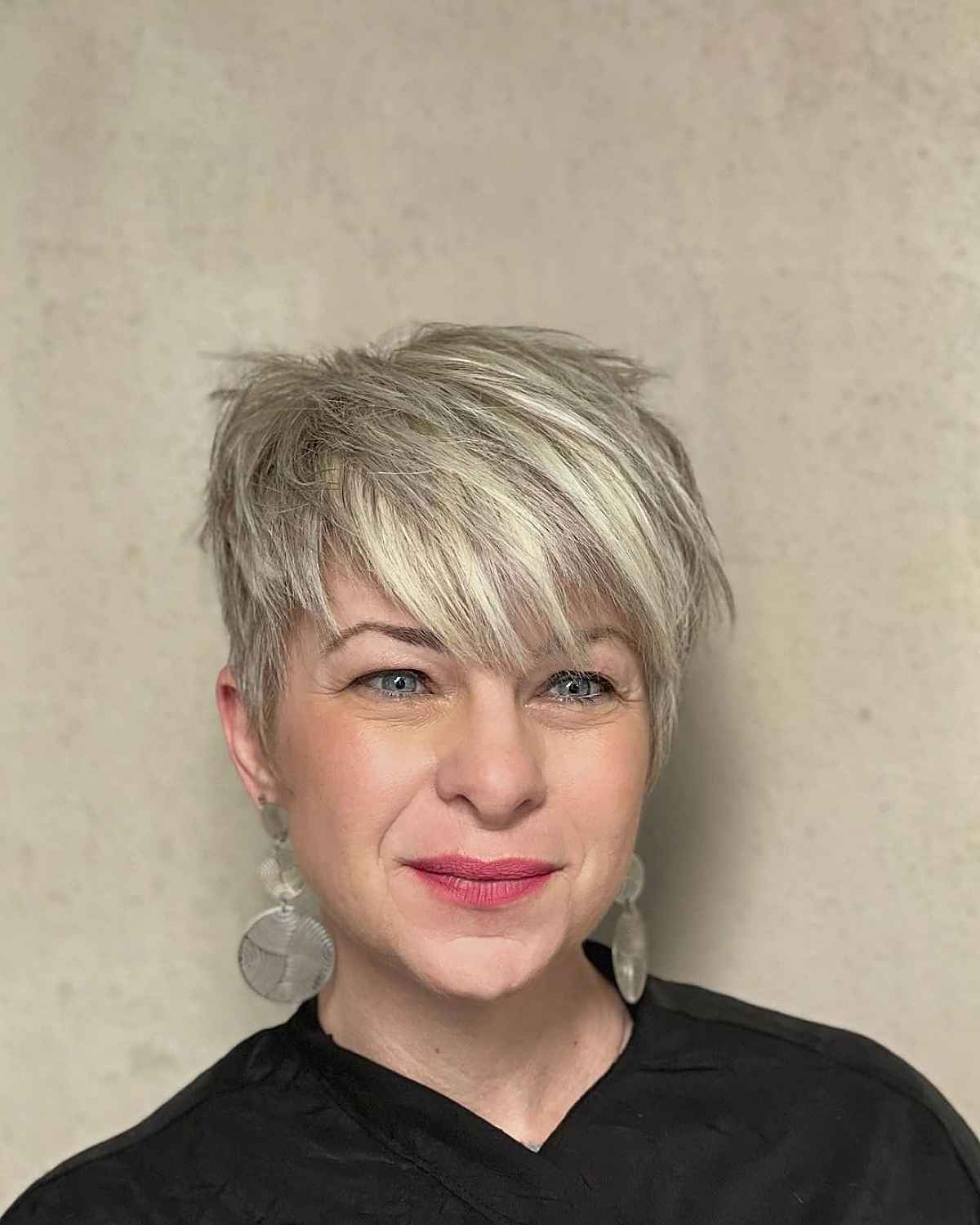 pixie crop for women turning 40s with choppy layers and bangs