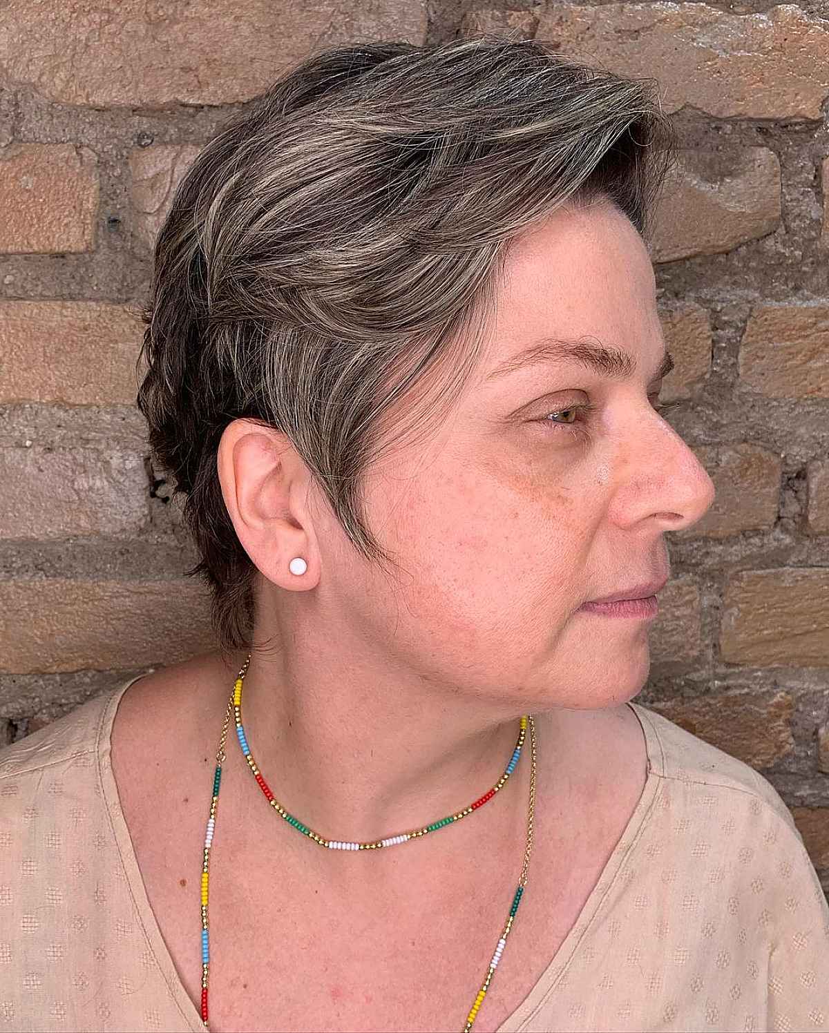 pixie haircut for women passed their 40s with feathered layers