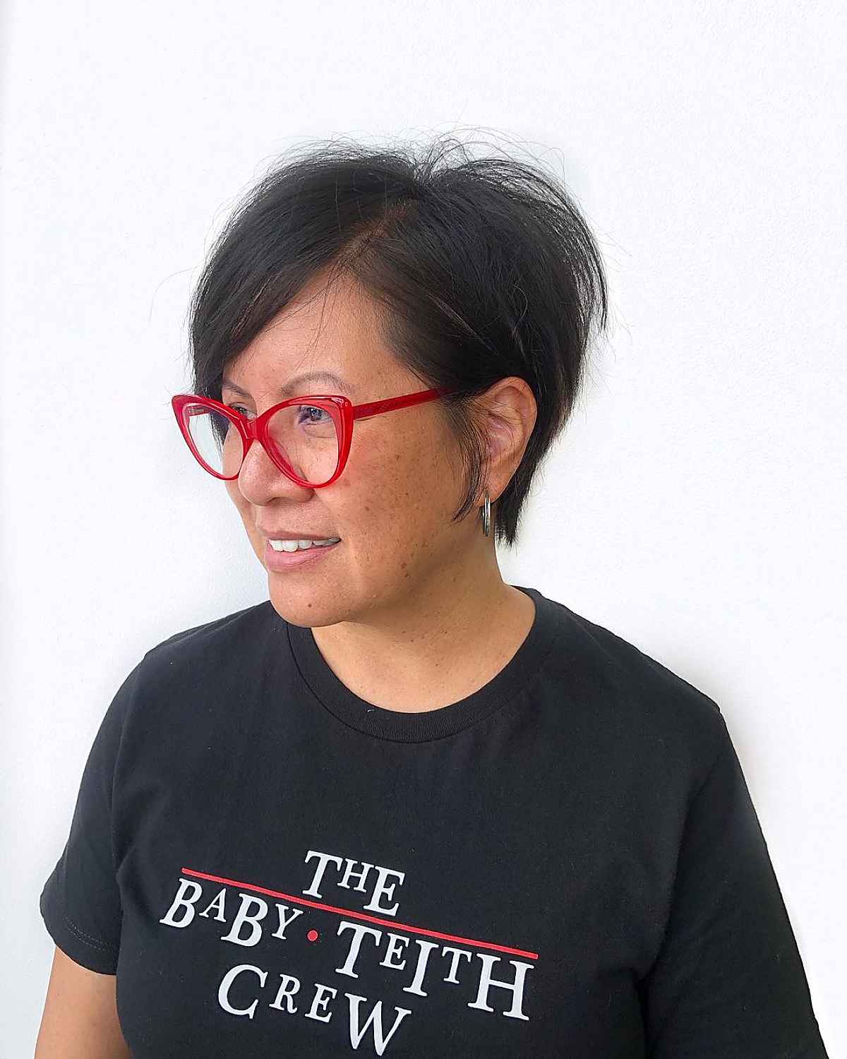 pixie with long bangs and stacked layers for middle aged women