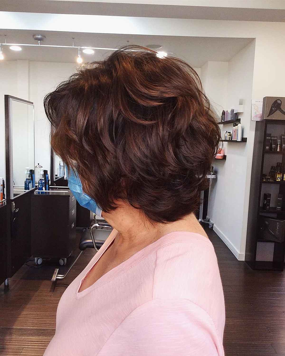 plumb and chestnut feathered bob for women in their sixties