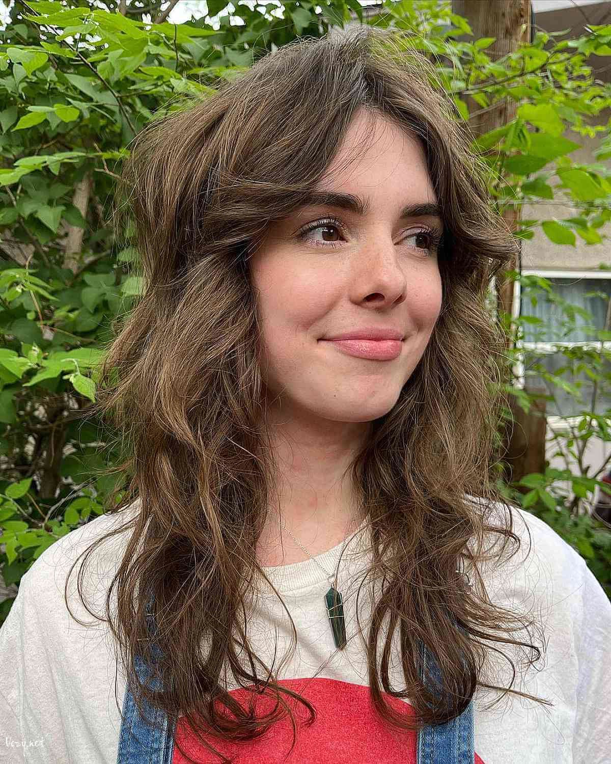 razor cut shag with middle part bangs