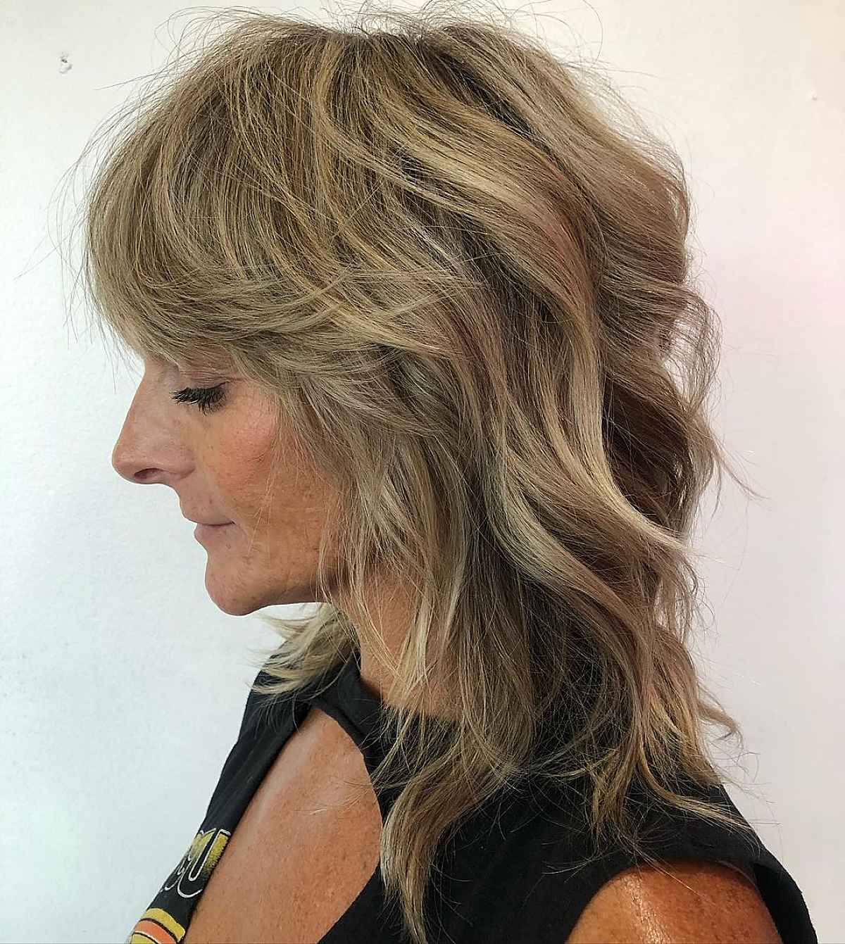 razored cut for a 60 year old woman with mid length hair