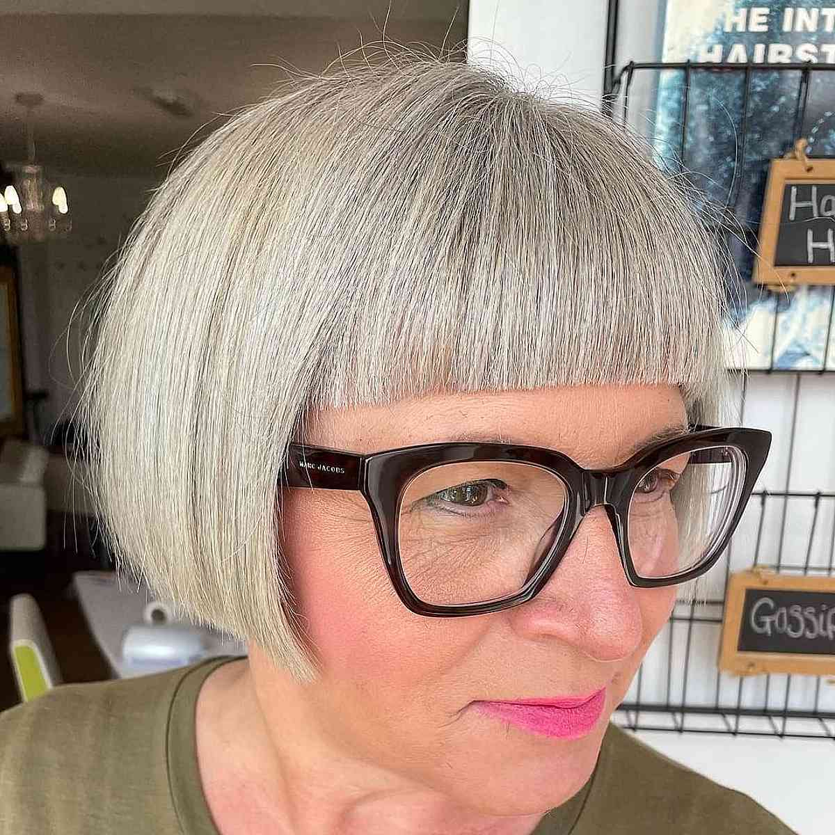 salt and pepper french bob with straight across bangs for ladies over 60 with glasses