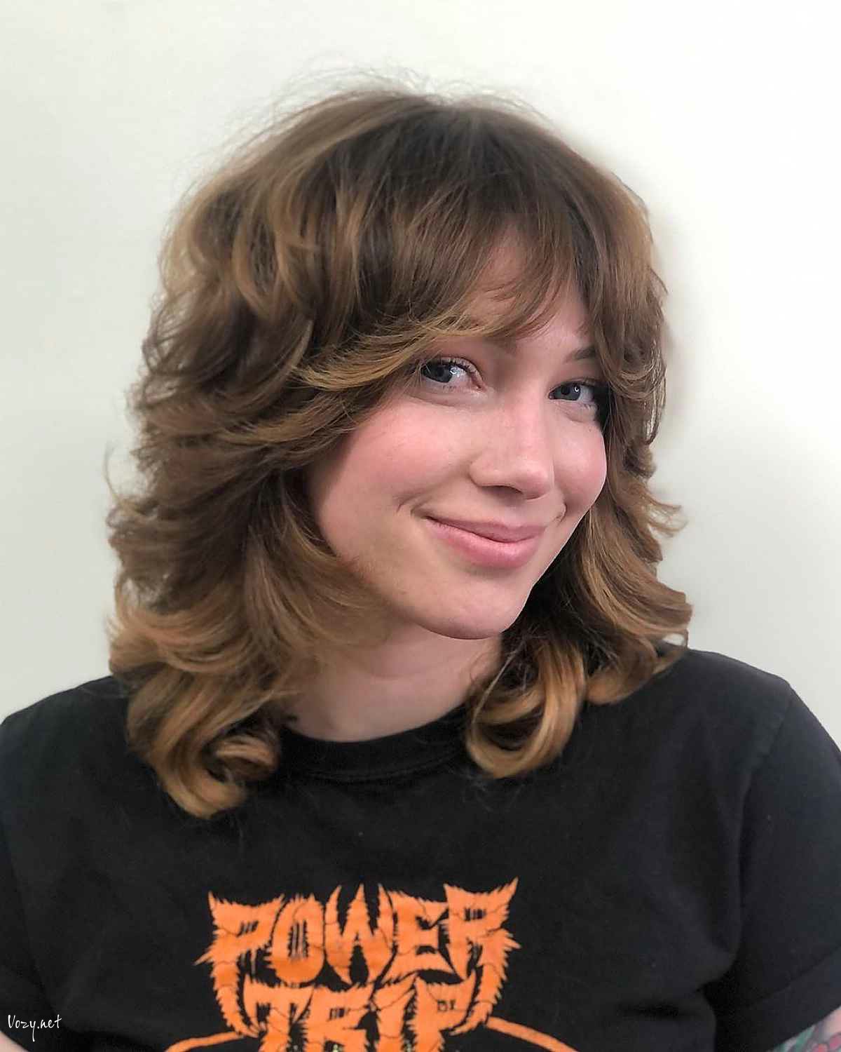 shag with shorter layers and curtain bangs