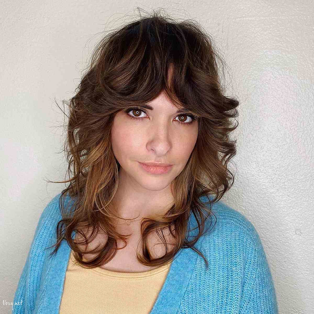 shaggy cut with feathery 70s curtain bangs