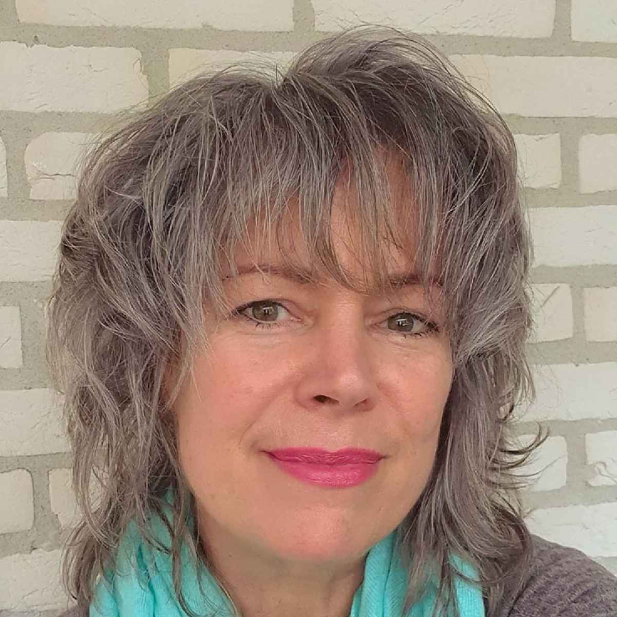 shaggy salt and pepper bob with bangs