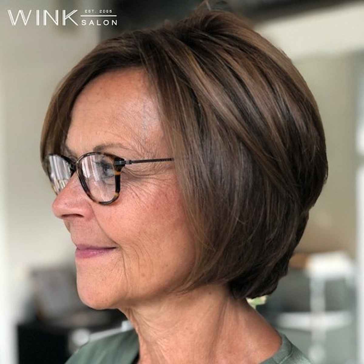 short and sophisticated bob with a side part for 60 year olds