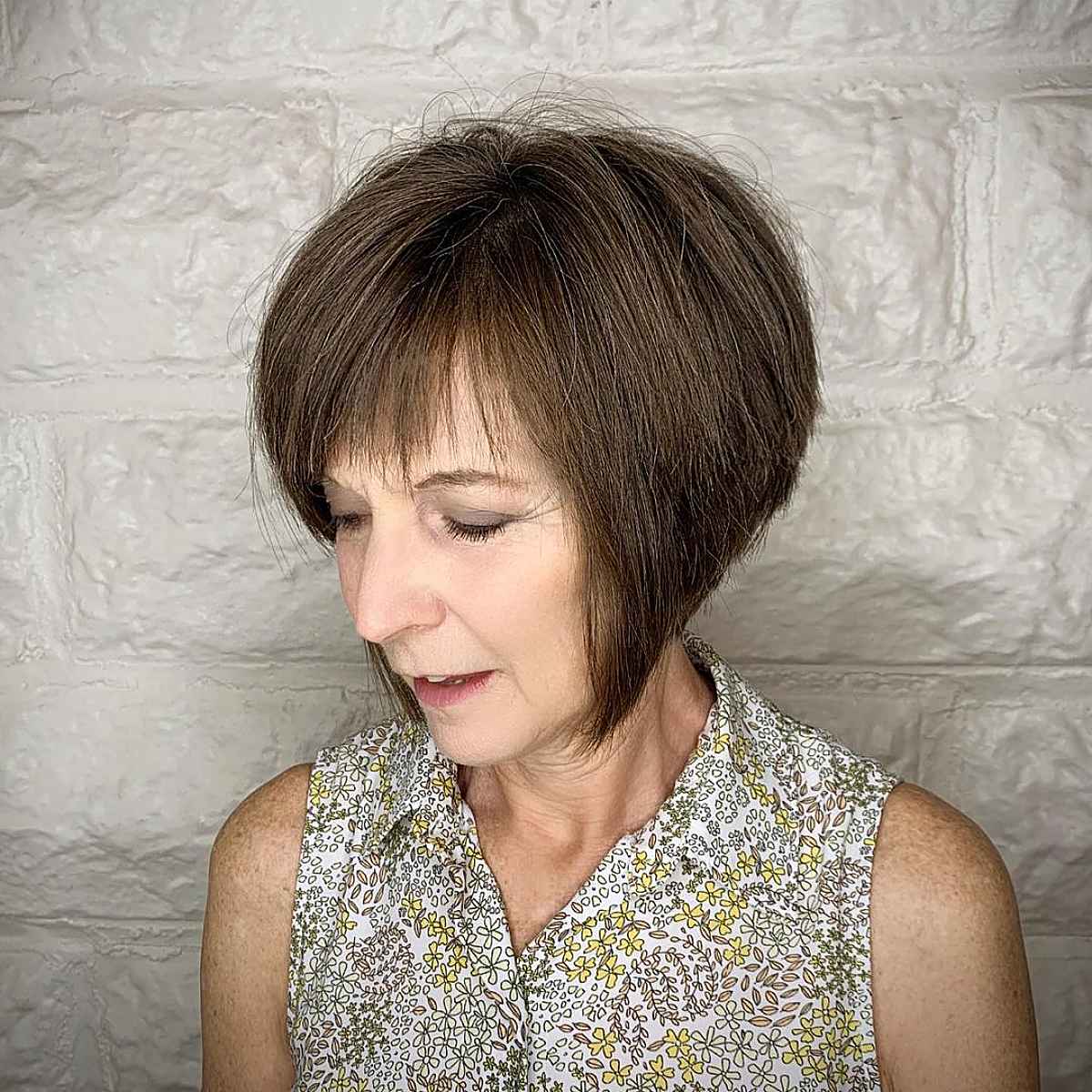 short angled bob haircut for a woman in her 60s