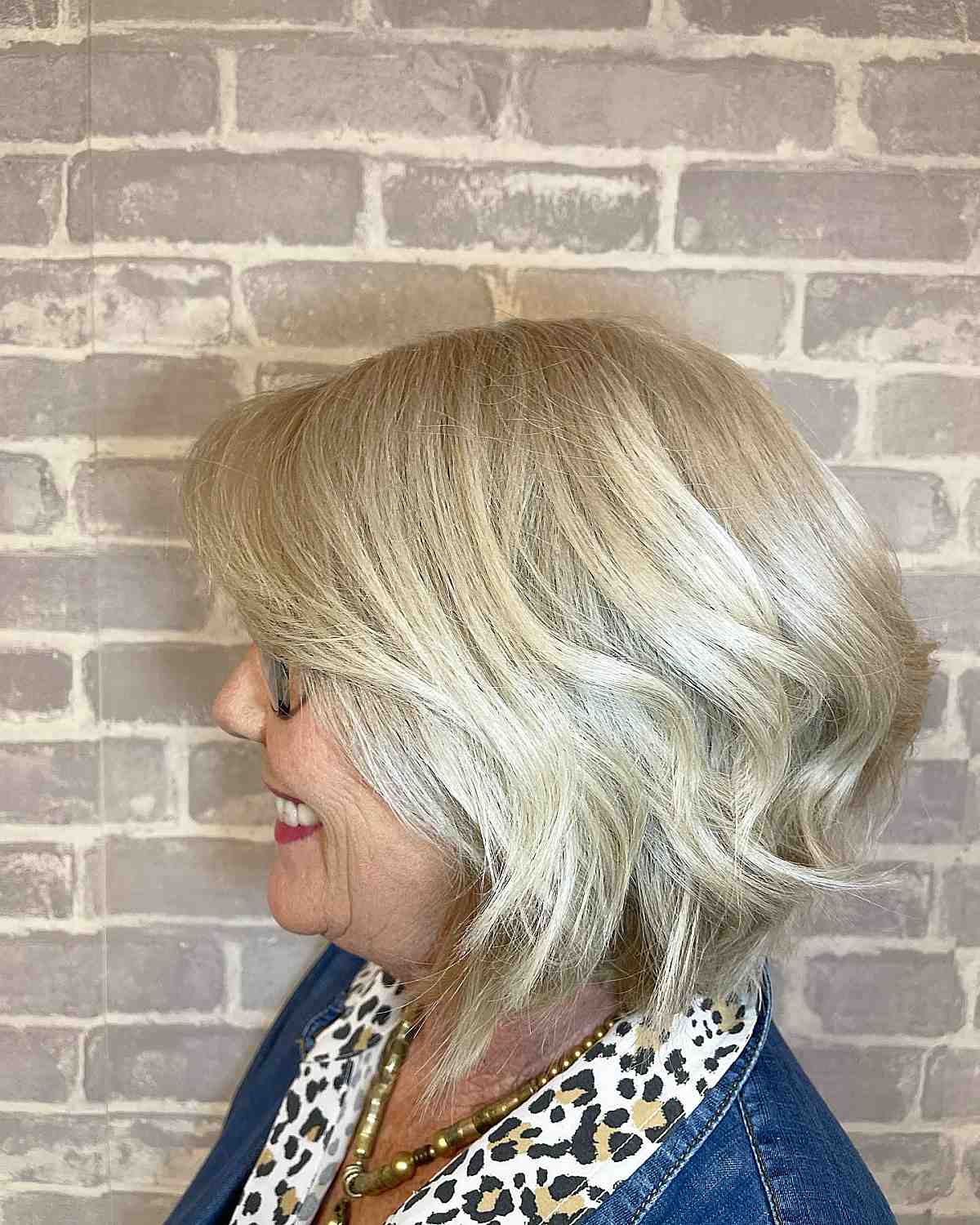 short blonde angled bob hairstyle for women past 60