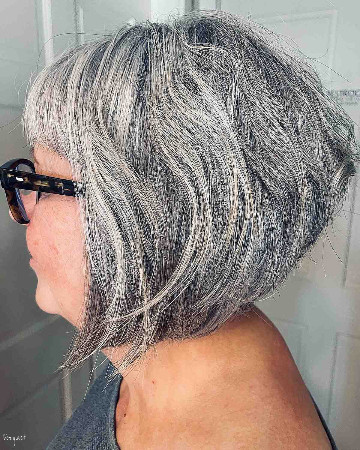 short bob hairstyle for ladies over 50 with glasses
