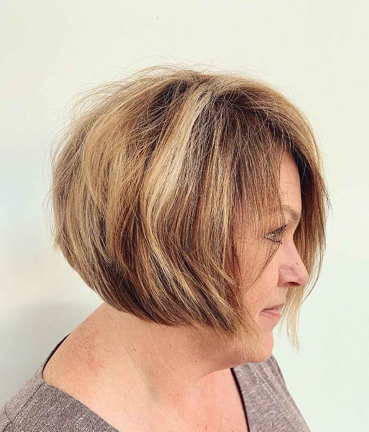 short bob with marigold highlights for a woman over 60