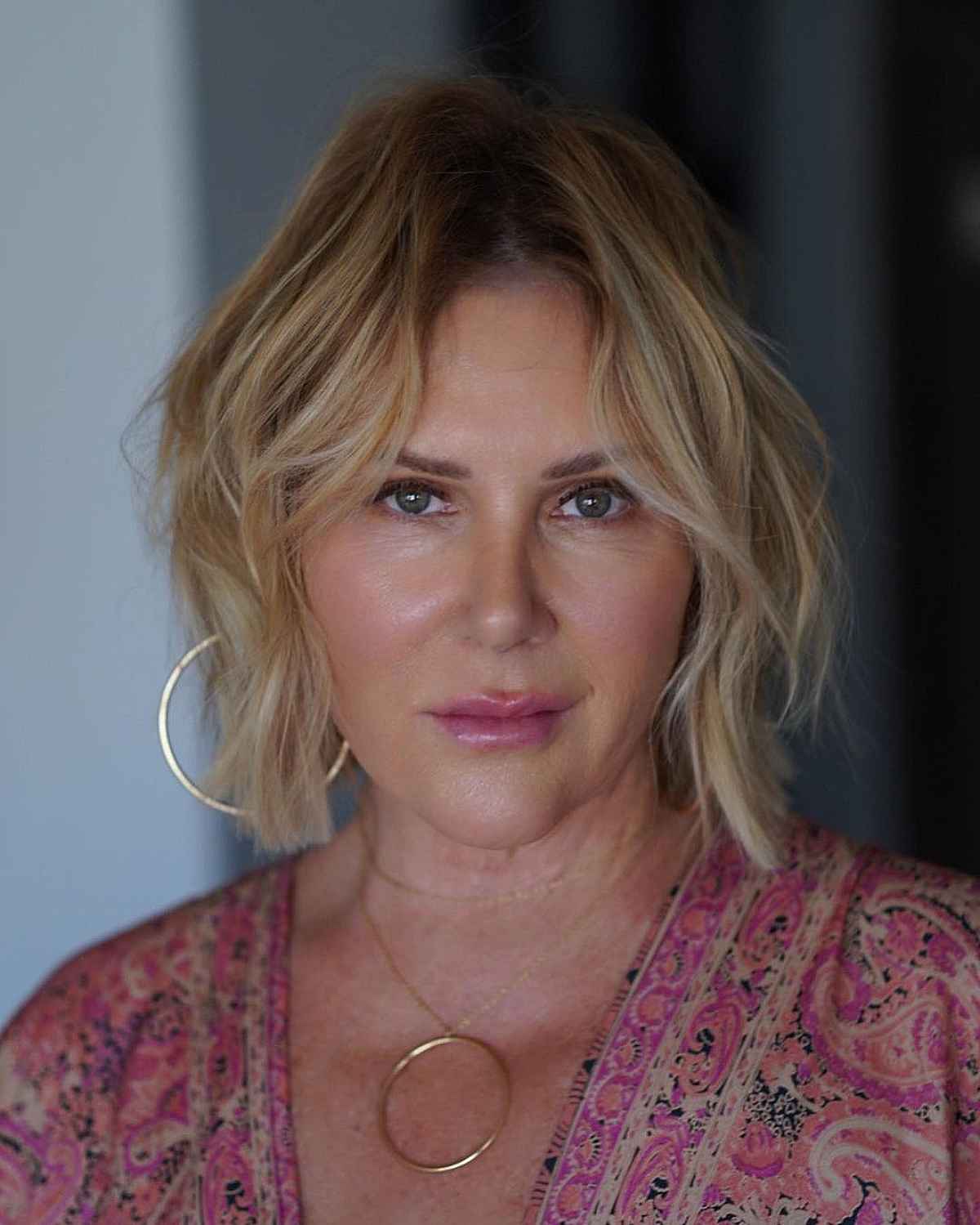 short bottleneck bob with curtain bangs for women over 60 with thin hair