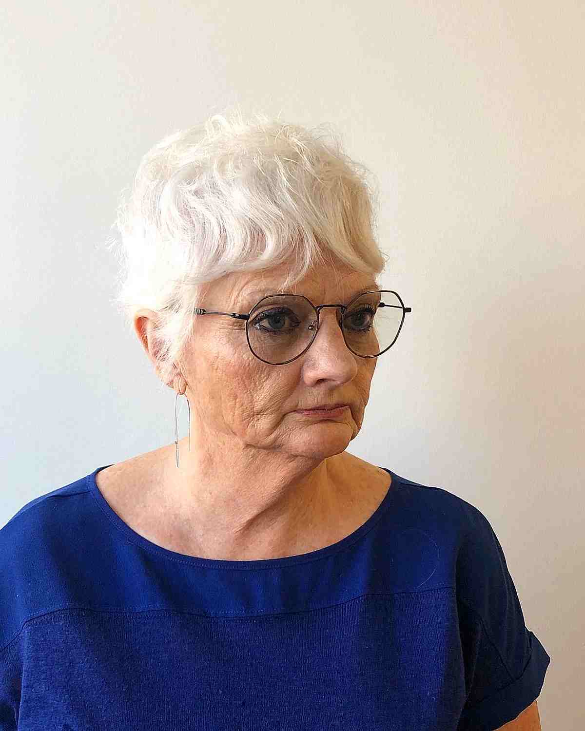 short hair with wavy curtain bangs and layers for ladies 60 and over