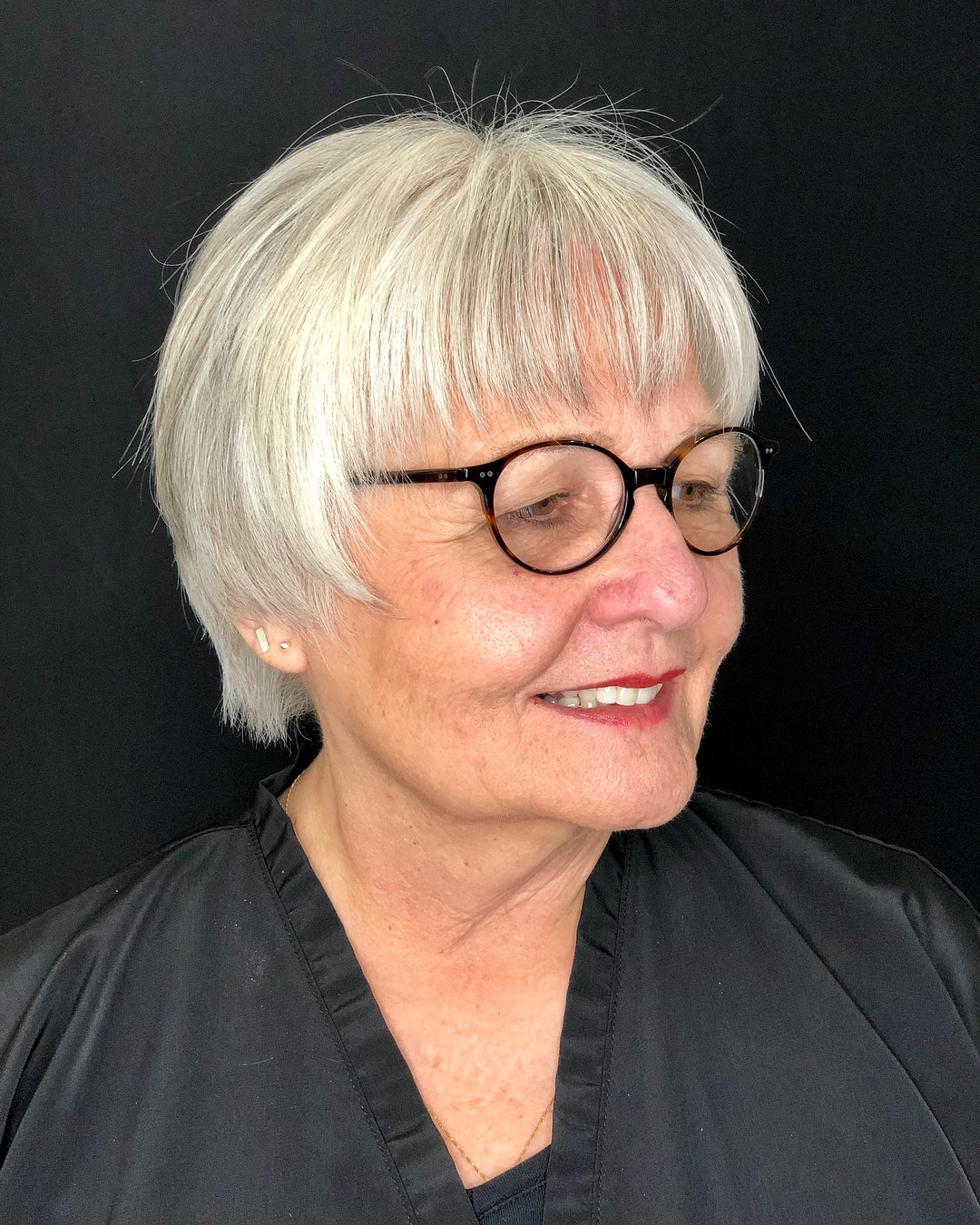 short hairstyle for over 50 with glasses and round face