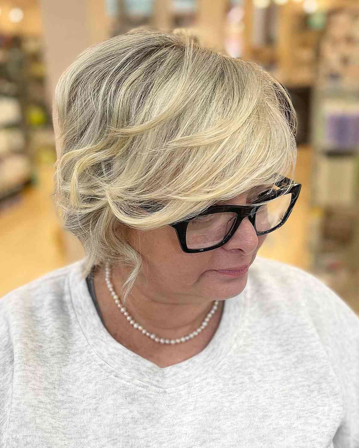 short layered cut with babylights for 50 year olds with glasses
