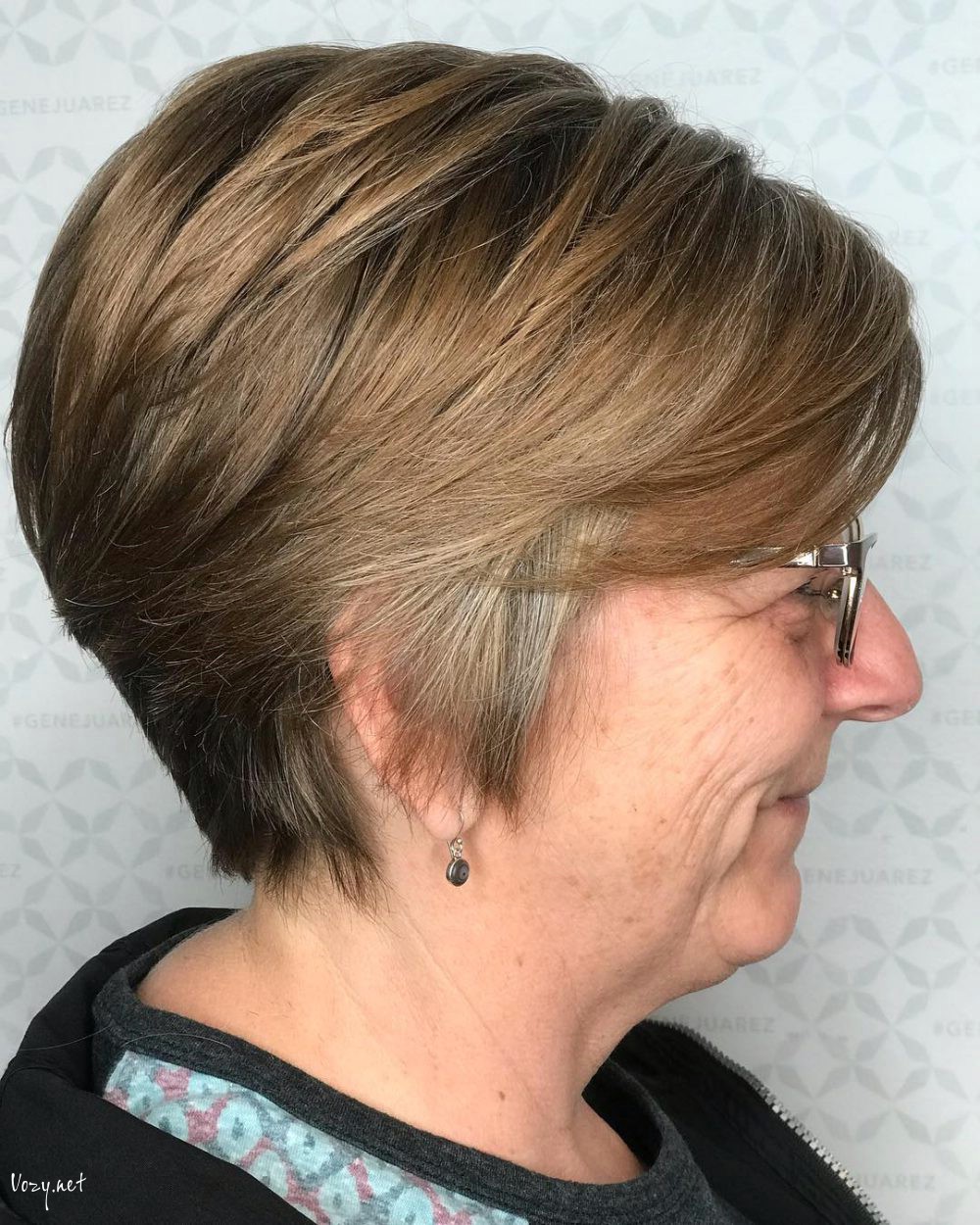 short layered hairstyle for over 50 with glasses
