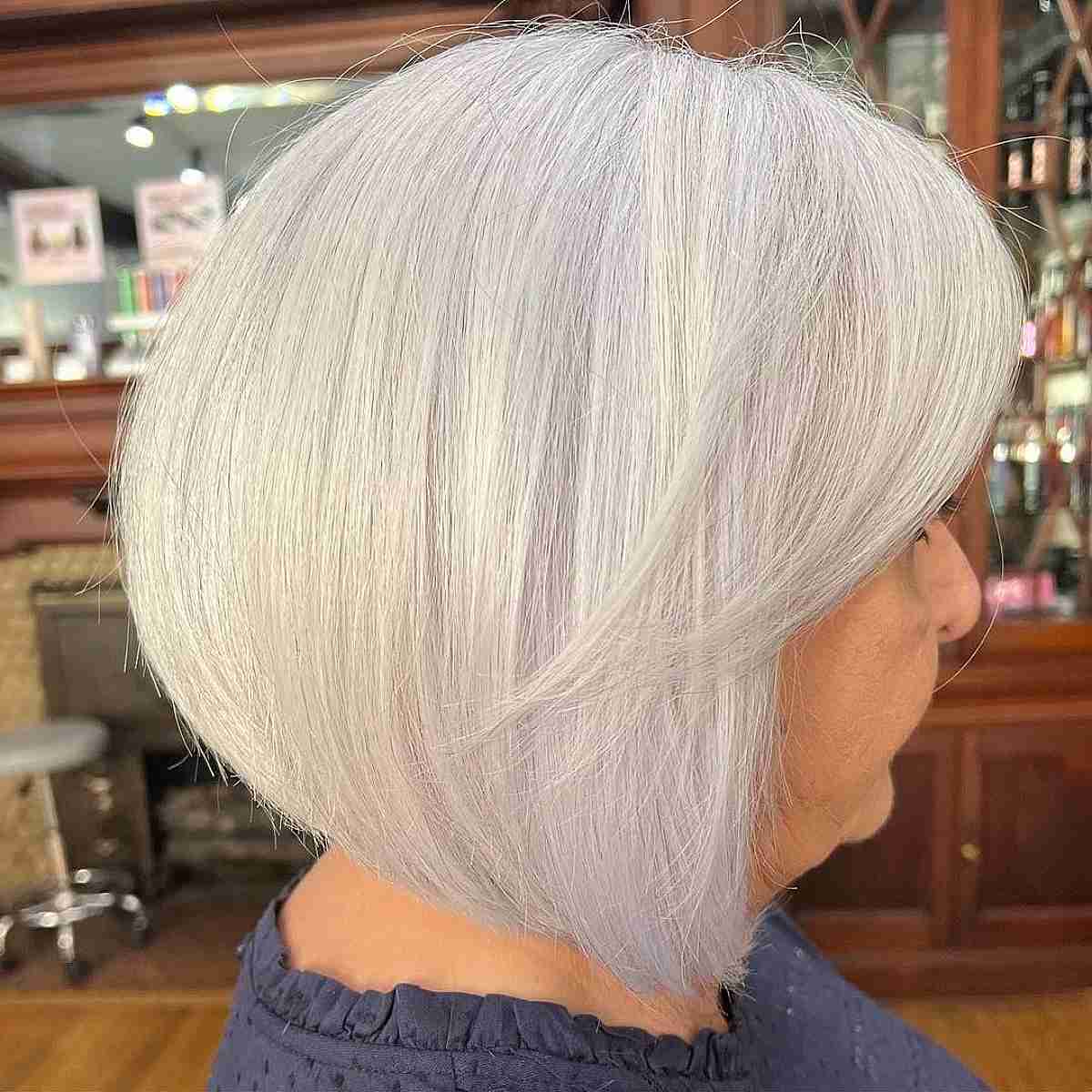 short round haircut with platinum blonde color for older women
