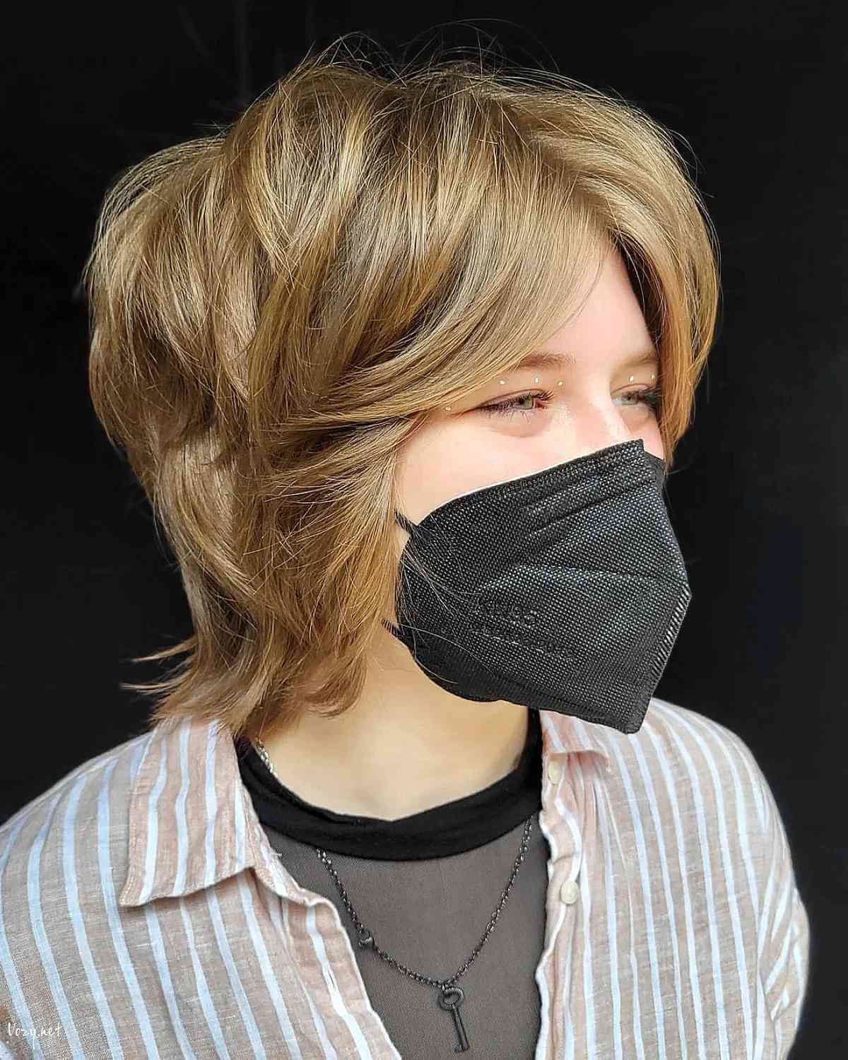 short shaggy wolf cut with curtain bangs for thick hair