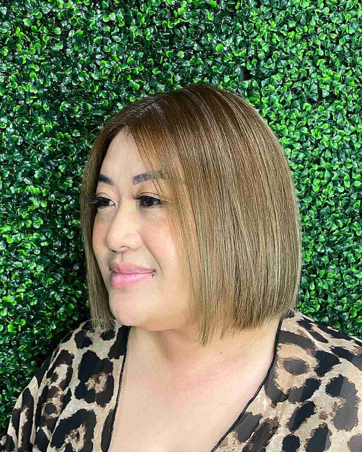 short sleek neck length haircut for round faces