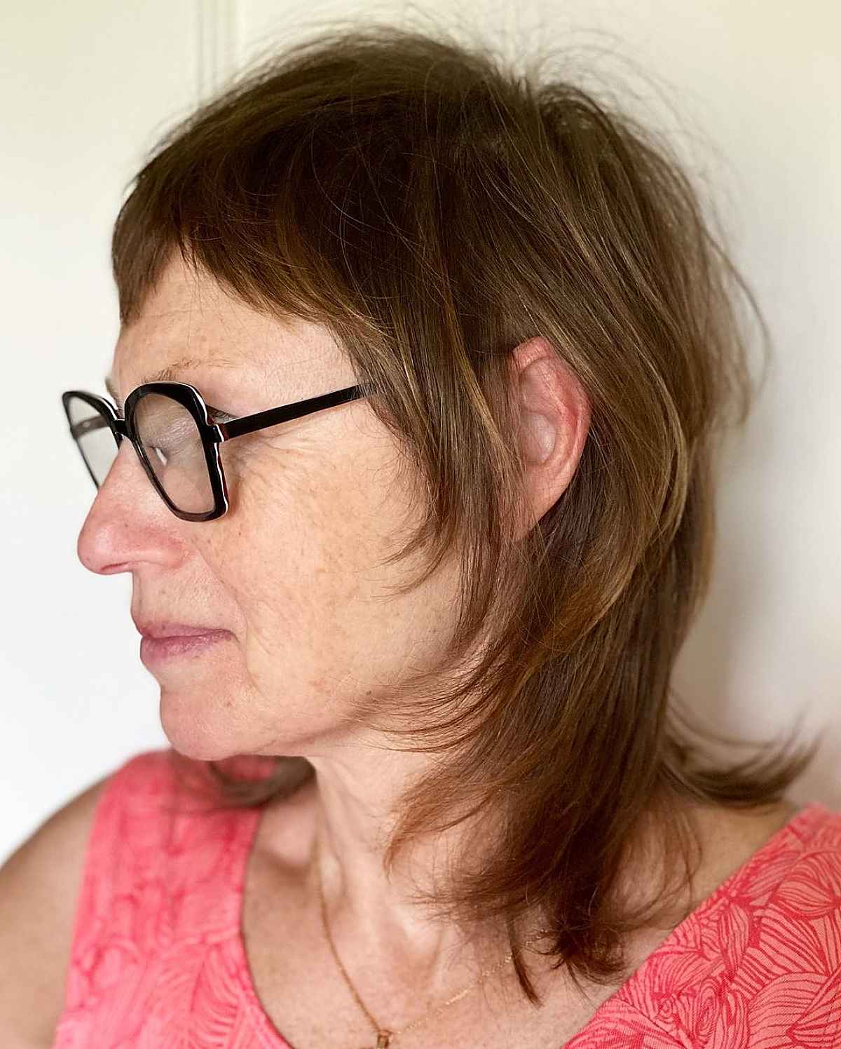 shoulder length hairstyle with glasses for ladies in their sixties