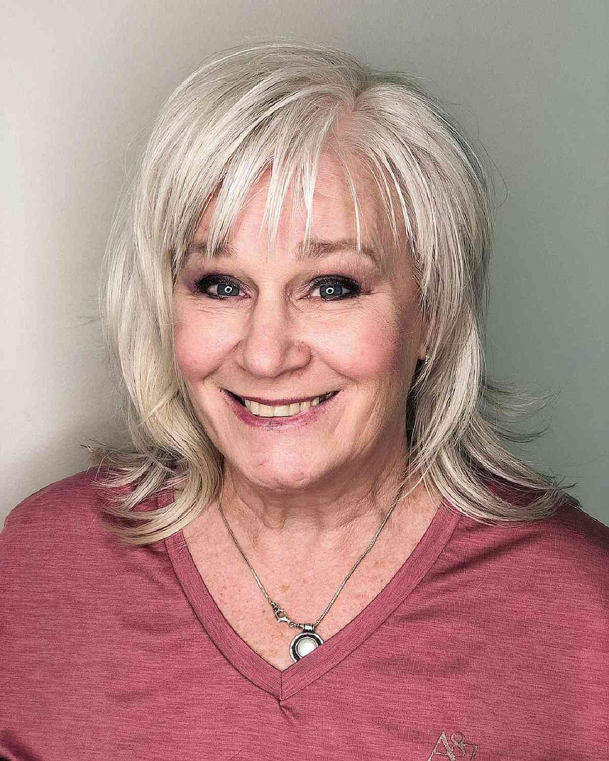 shoulder length shaggy bob for big women aged sixties with wispy bangs