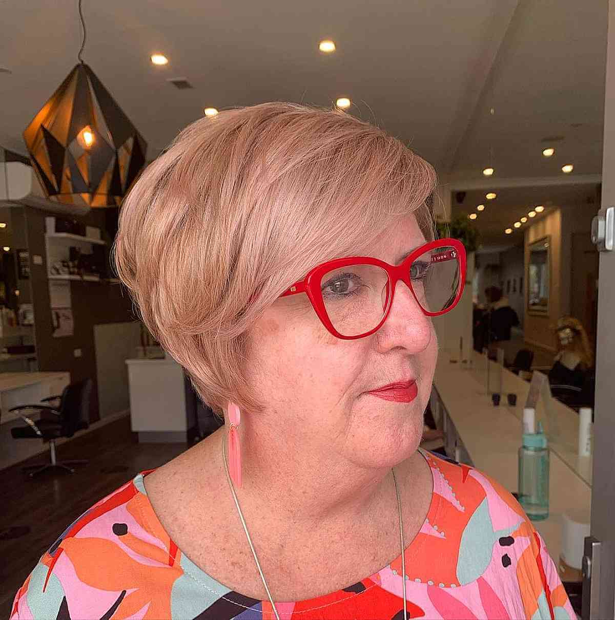 side swept lixie for round faces for a woman over seventy