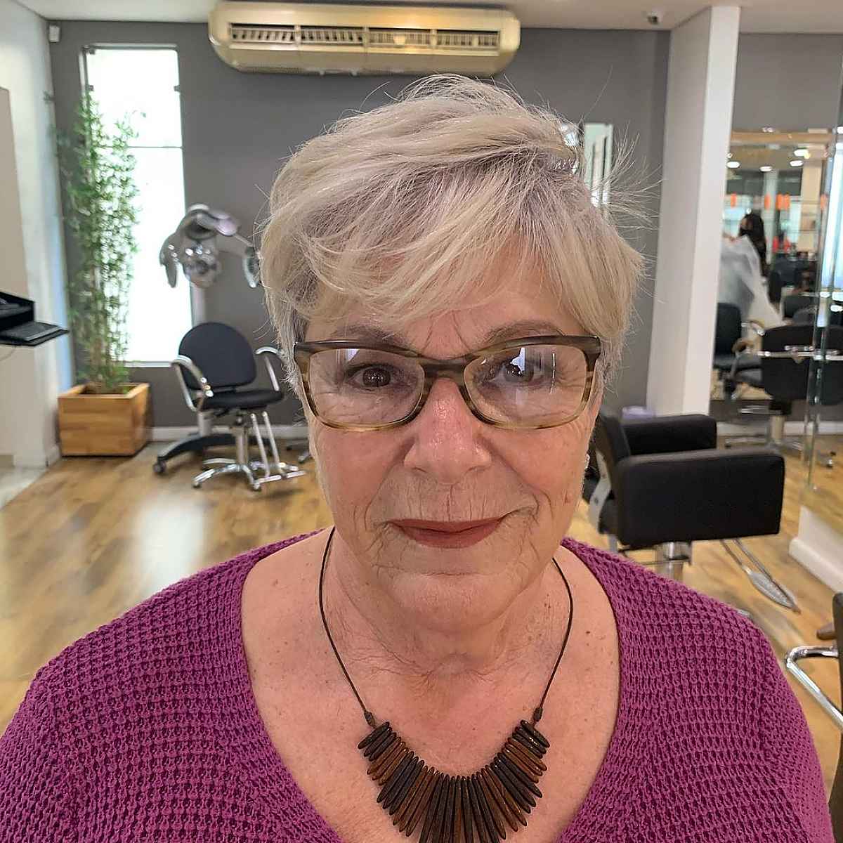 silver pixie cut with bangs and glasses for women past 60