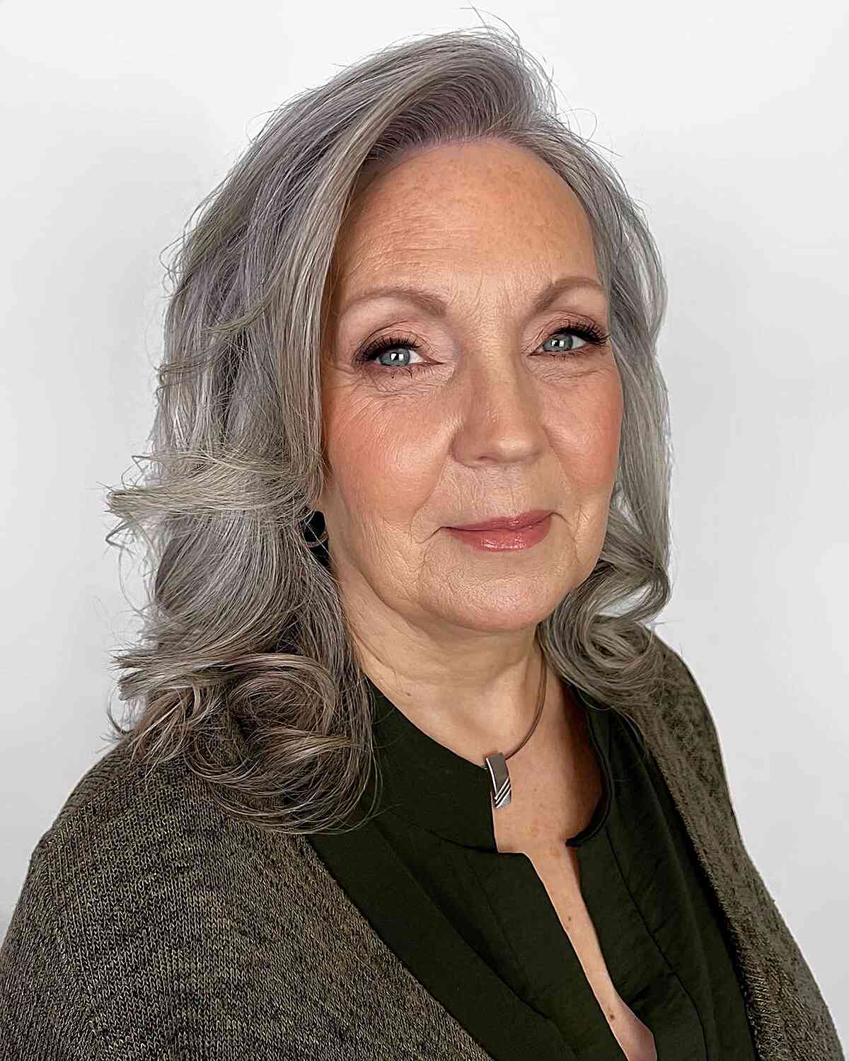 silver side parted mid length chop for ladies past 60