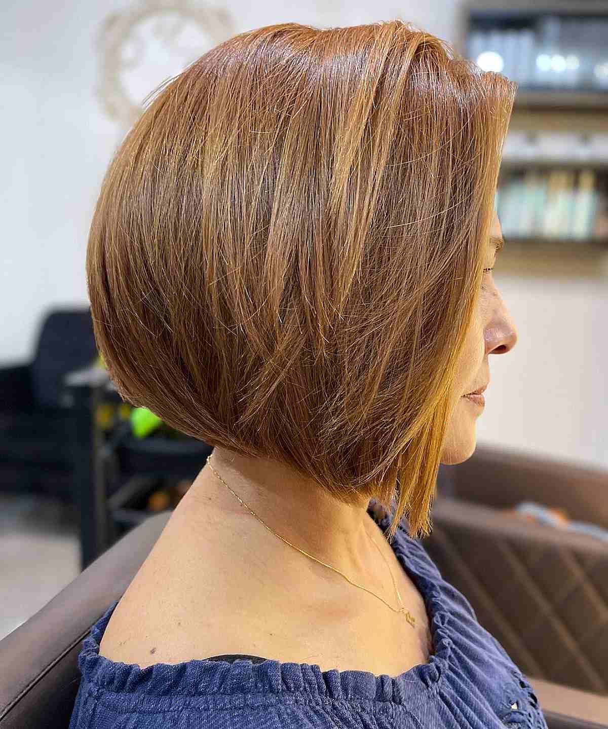 sleek and youthful angled bob for women over fifty