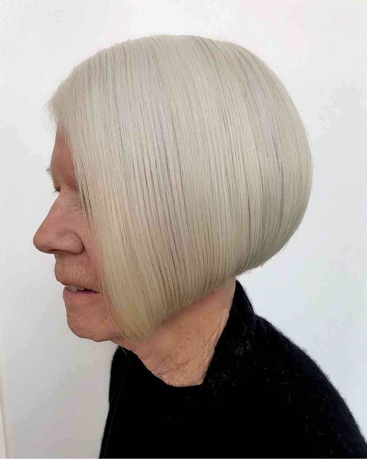 sleek angled bob cut on older ladies past 70