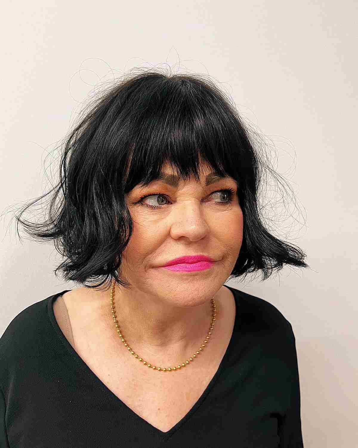 soft bob with textured bangs for an old lady