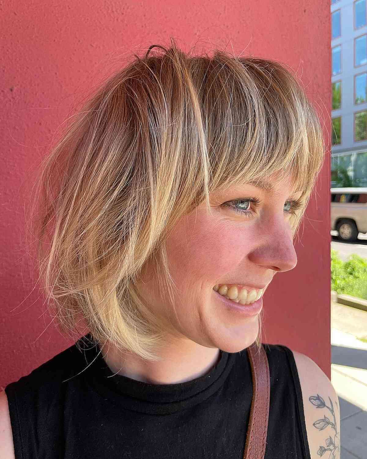 soft messy neck length bob with bangs
