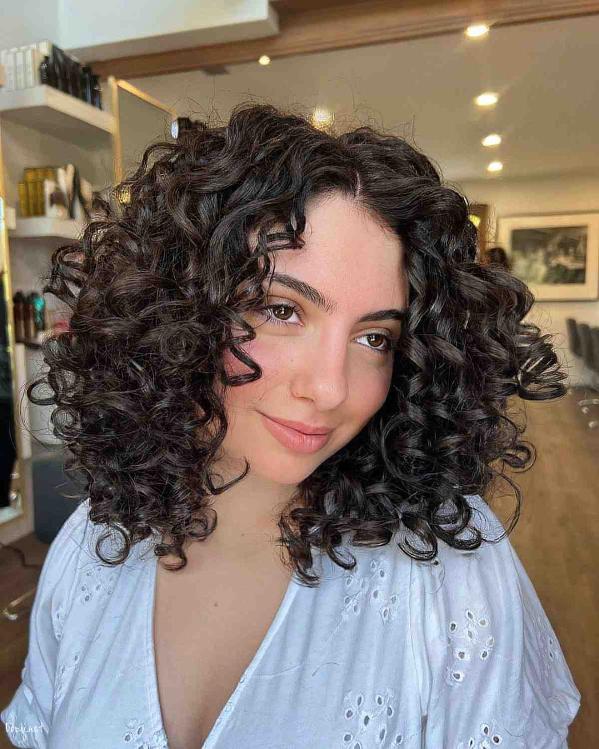 stunning dark layered curls with no bangs