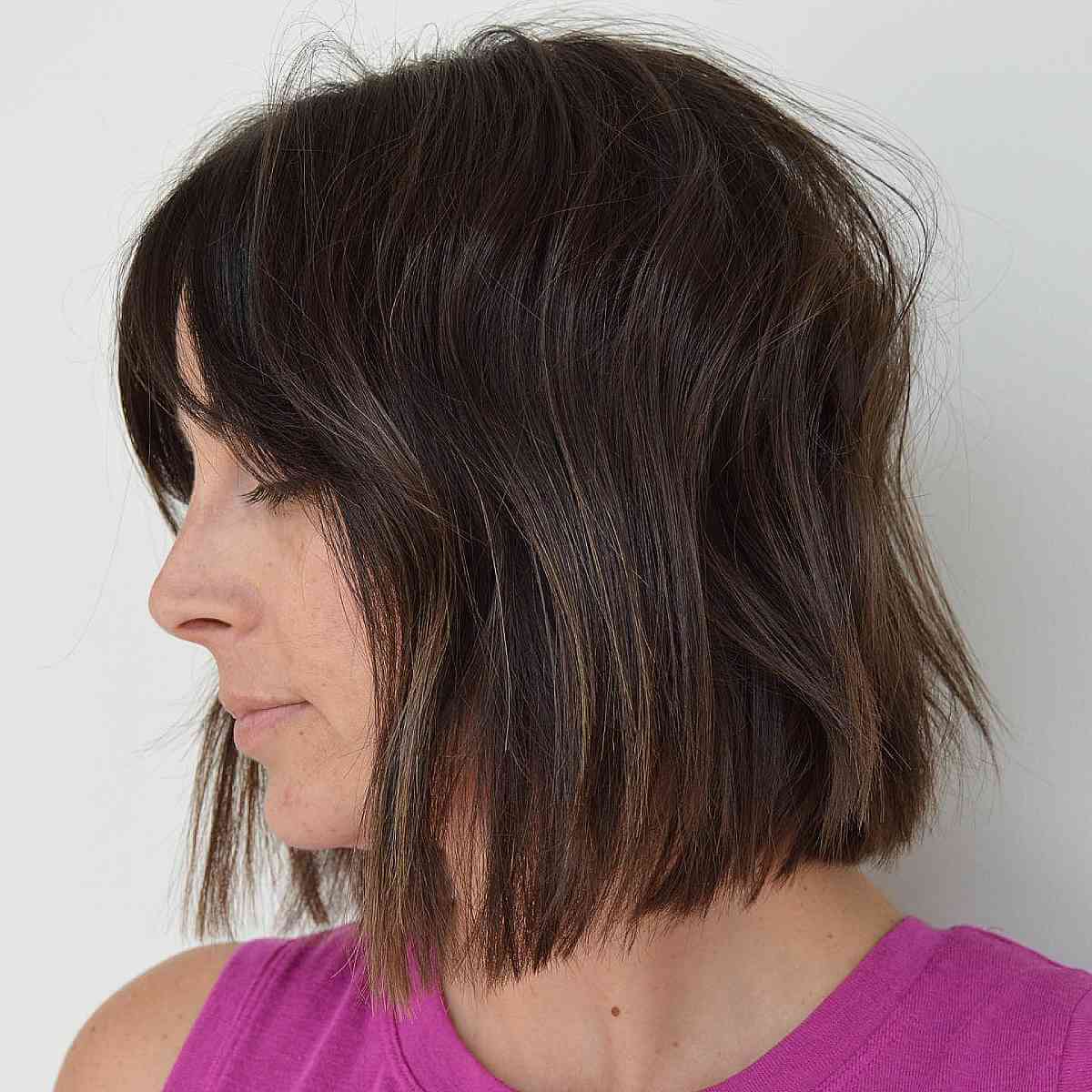 textured neck length blunt cut with a fringe