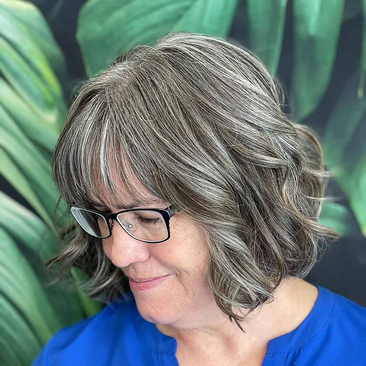 tousled bob with bangs and glasses for 60 year olds