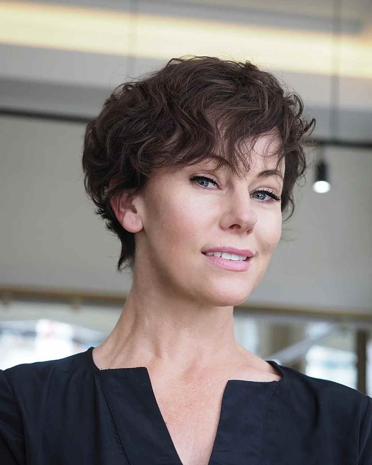 tousled brunette pixie with fringe for fifty year olds