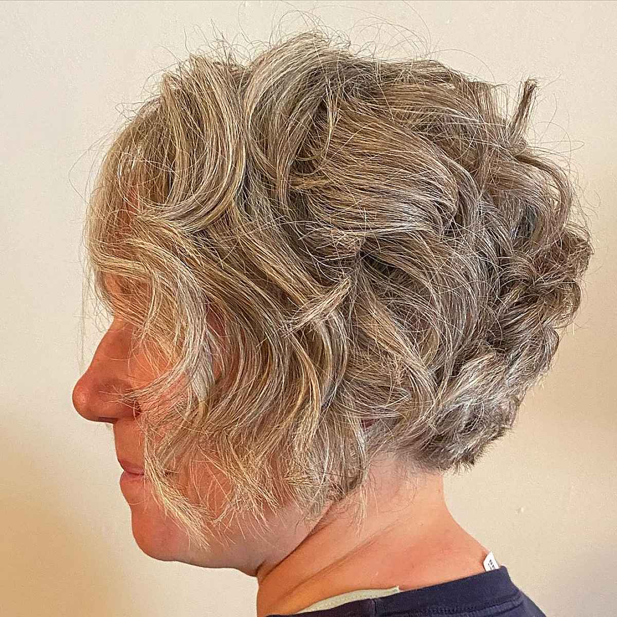tousled layered hairstyle on womens short silver hair